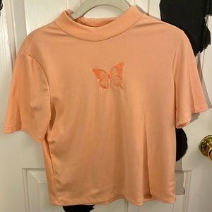 Turtleneck T-shirt with a butterfly on it